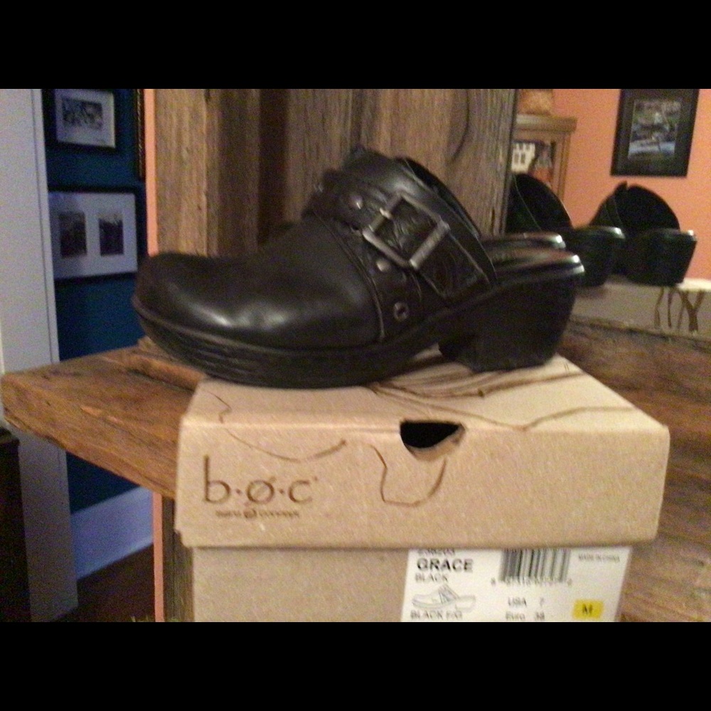 Cool black leather clogs.